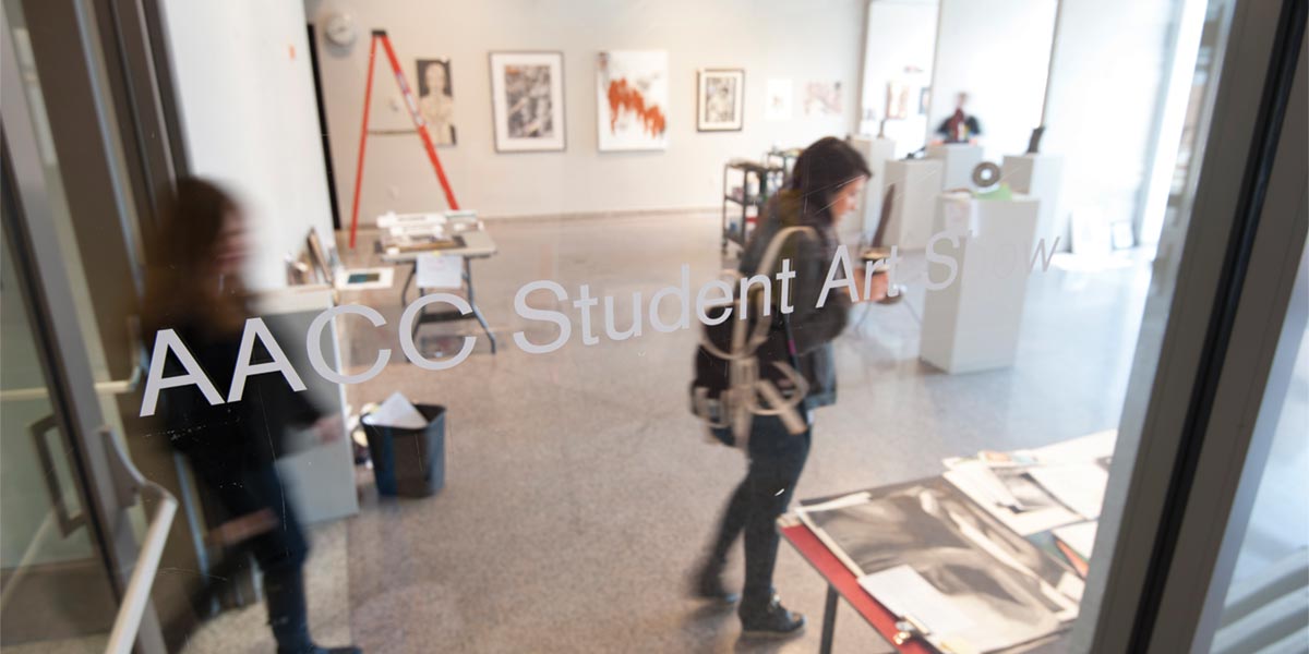 Visitors enter an AACC student art exhibit.