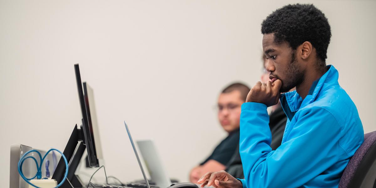 Student working on computer.